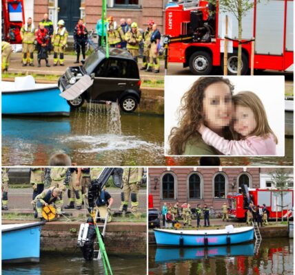 🚨 Paniek op de Herengracht: Moeder en kind rijden met mini-auto het water in – omstanders en reddingsteams grijpen direct in!